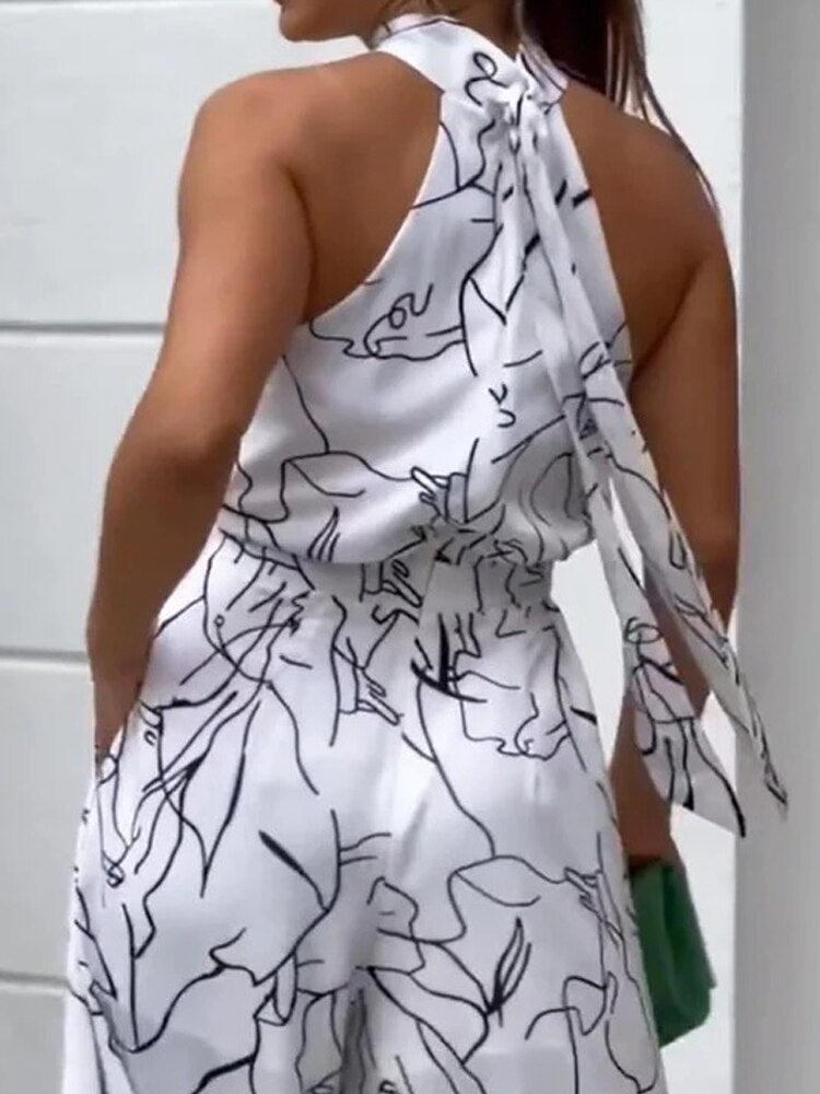 Sleeveless Hanging Neck Pants Print Jumpsuits - JELESACK